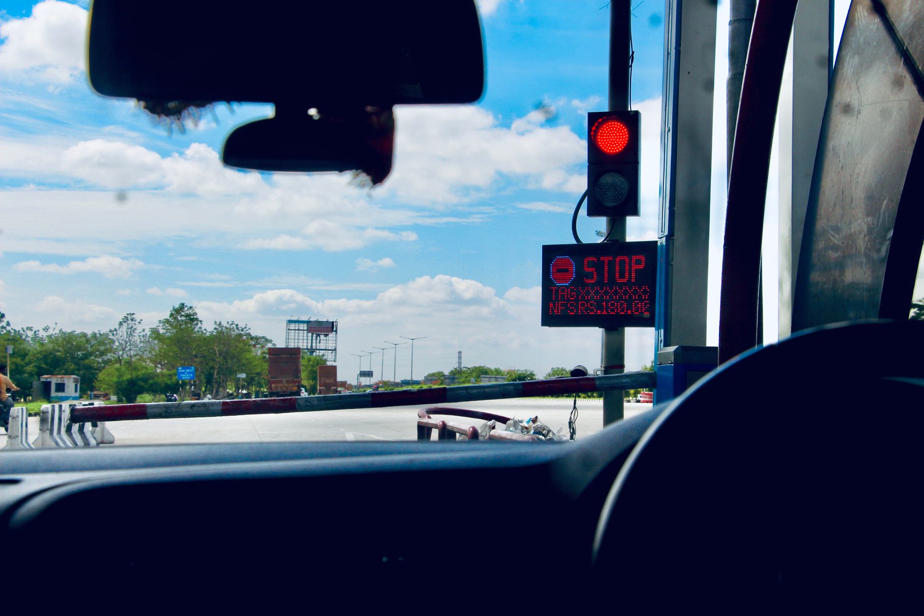 road and stop sign viewed from car